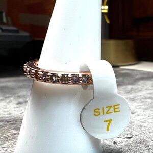 Ring Bomb Party Ring, NWOT, size 7, rose gold color band with minis clear stones